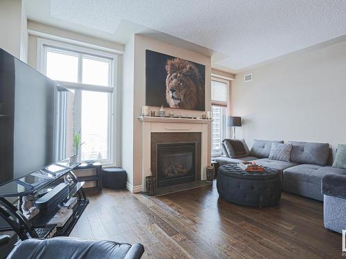 1201 9020 Jasper Avenue Nw, Edmonton, AB - Indoor Photo Showing Living Room With Fireplace