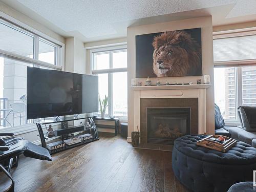 1201 9020 Jasper Avenue Nw, Edmonton, AB - Indoor Photo Showing Living Room With Fireplace