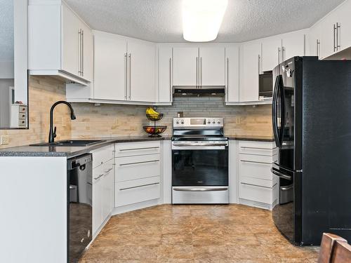 #179 St. Andrews Drive, Stony Plain, AB - Indoor Photo Showing Living Room With Fireplace