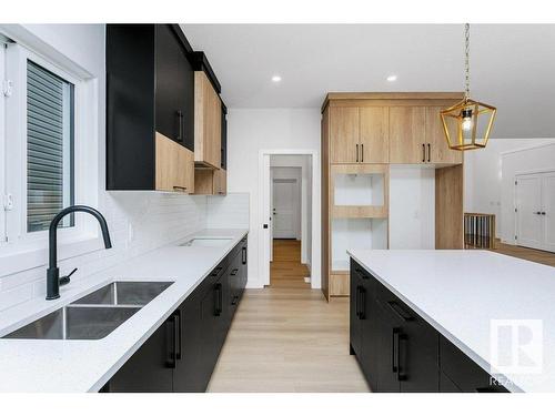 67 Dalquist Bay, Leduc, AB - Indoor Photo Showing Kitchen With Double Sink