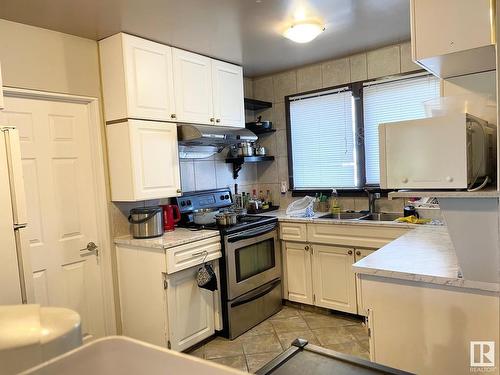 5119 Fourier Drive, Calgary, AB - Indoor Photo Showing Kitchen With Double Sink