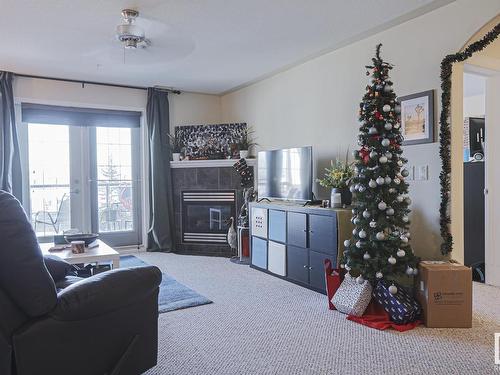 409 261 Youville Drive E, Edmonton, AB - Indoor Photo Showing Other Room With Fireplace