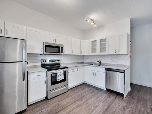 8918D 144 Avenue, Edmonton, AB - Indoor Photo Showing Kitchen With Double Sink