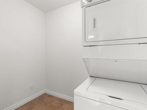 512 9910 107 Street, Morinville, AB - Indoor Photo Showing Laundry Room