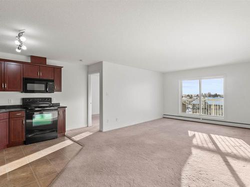 512 9910 107 Street, Morinville, AB - Indoor Photo Showing Kitchen