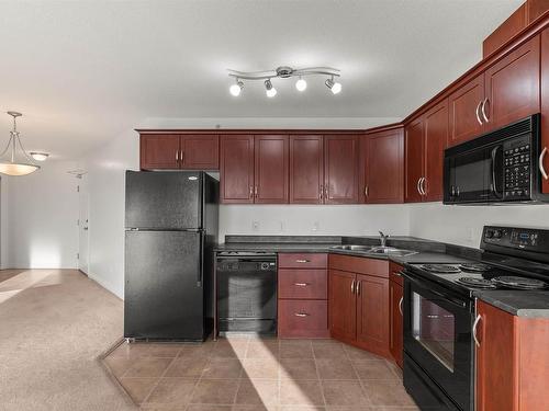 512 9910 107 Street, Morinville, AB - Indoor Photo Showing Kitchen With Double Sink