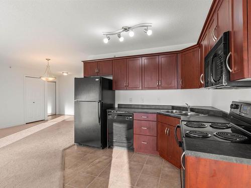 512 9910 107 Street, Morinville, AB - Indoor Photo Showing Kitchen With Double Sink