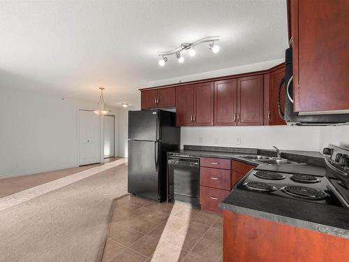 512 9910 107 Street, Morinville, AB - Indoor Photo Showing Kitchen With Double Sink