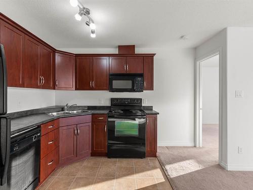 512 9910 107 Street, Morinville, AB - Indoor Photo Showing Kitchen With Double Sink