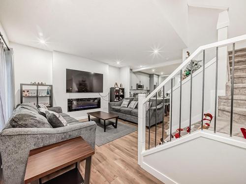 1215 Eaton Lane, Edmonton, AB - Indoor Photo Showing Other Room With Fireplace