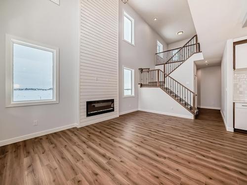 352 Bluff Cove, Leduc, AB - Indoor Photo Showing Other Room With Fireplace