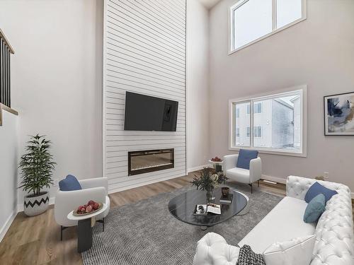 356 Bluff Cove, Leduc, AB - Indoor Photo Showing Living Room With Fireplace