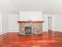 18 10160 119 Street Nw, Edmonton, AB  - Indoor Photo Showing Living Room With Fireplace 