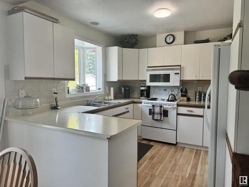 4607 Champagne Drive, Athabasca Town, AB - Indoor Photo Showing Kitchen With Double Sink