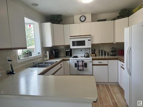 4607 Champagne Drive, Athabasca Town, AB - Indoor Photo Showing Kitchen With Double Sink