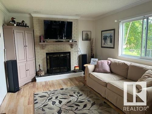 4607 Champagne Drive, Athabasca Town, AB - Indoor Photo Showing Living Room With Fireplace