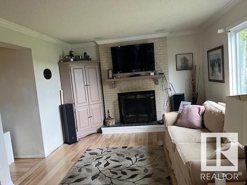 4607 Champagne Drive, Athabasca Town, AB - Indoor Photo Showing Living Room With Fireplace