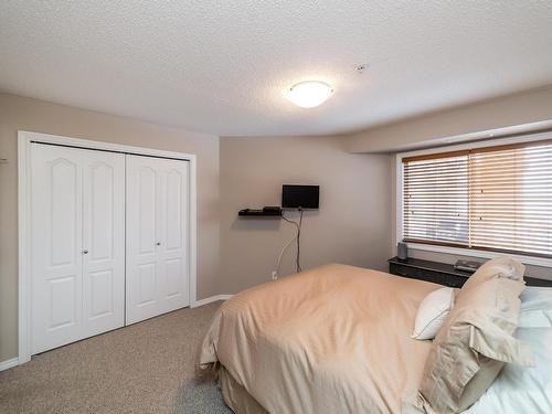 326 7801 Golf Course Road, Stony Plain, AB - Indoor Photo Showing Bedroom