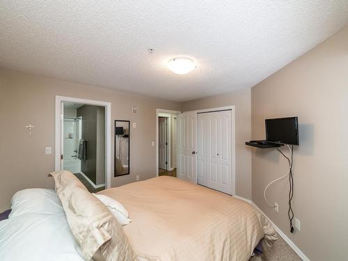 326 7801 Golf Course Road, Stony Plain, AB - Indoor Photo Showing Bedroom