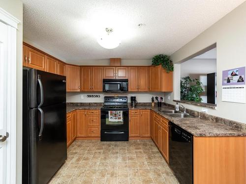 326 7801 Golf Course Road, Stony Plain, AB - Indoor Photo Showing Kitchen With Double Sink