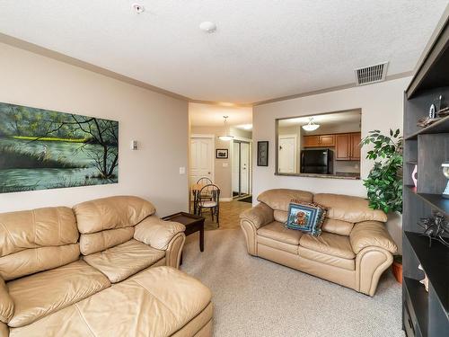 326 7801 Golf Course Road, Stony Plain, AB - Indoor Photo Showing Living Room