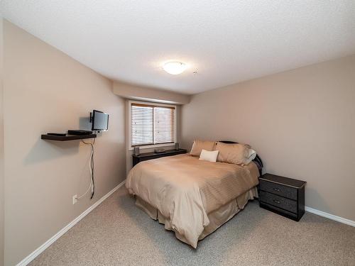 326 7801 Golf Course Road, Stony Plain, AB - Indoor Photo Showing Bedroom