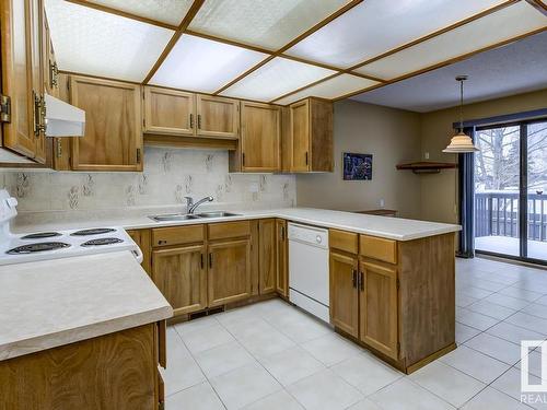 10860 11 Avenue, Edmonton, AB - Indoor Photo Showing Kitchen With Double Sink