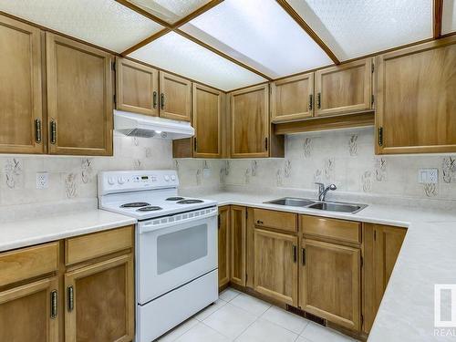 10860 11 Avenue, Edmonton, AB - Indoor Photo Showing Kitchen With Double Sink