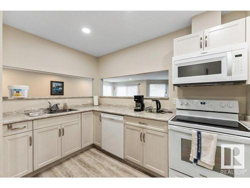 10860 11 Avenue, Edmonton, AB - Indoor Photo Showing Kitchen With Double Sink