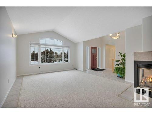 240 49547 Rge Road 243, Rural Leduc County, AB - Indoor Photo Showing Living Room With Fireplace