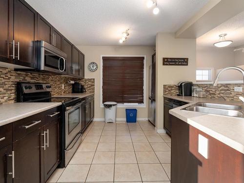 101 1804 70 Street, Edmonton, AB - Indoor Photo Showing Kitchen With Stainless Steel Kitchen With Double Sink With Upgraded Kitchen