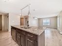 302 4008 Savaryn Drive, Edmonton, AB  - Indoor Photo Showing Kitchen With Double Sink 