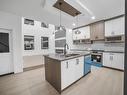 145 Creekside Lane, Leduc, AB  - Indoor Photo Showing Kitchen With Double Sink 