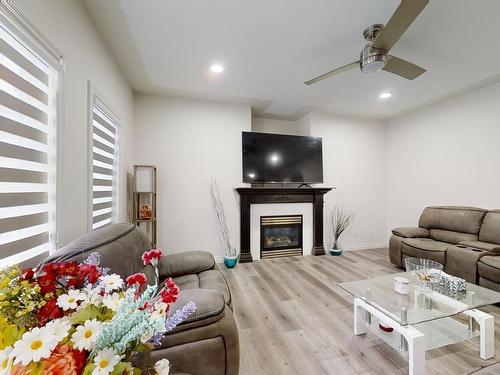 115 Lakeland Drive, Beaumont, AB - Indoor Photo Showing Other Room With Fireplace