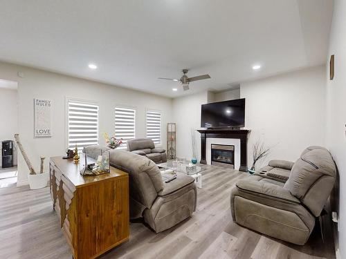 115 Lakeland Drive, Beaumont, AB - Indoor Photo Showing Living Room With Fireplace