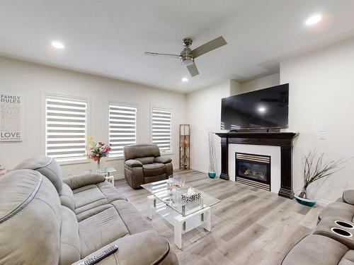 115 Lakeland Drive, Beaumont, AB - Indoor Photo Showing Living Room With Fireplace