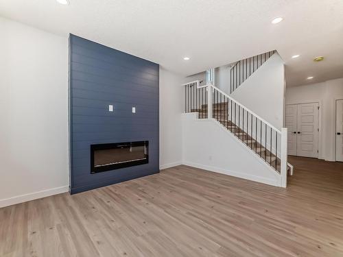 207 Kettyl Co Nw, Leduc, AB - Indoor Photo Showing Living Room With Fireplace