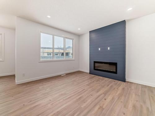 207 Kettyl Co Nw, Leduc, AB - Indoor Photo Showing Living Room With Fireplace