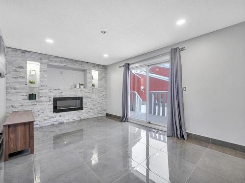 10634 Beaumaris Road, Edmonton, AB - Indoor Photo Showing Other Room With Fireplace