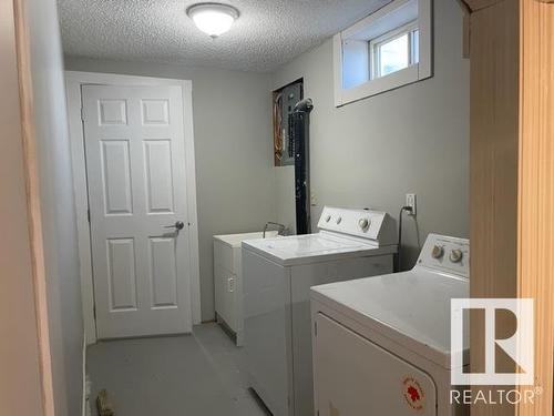 Calgary, AB - Indoor Photo Showing Laundry Room