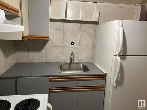 Calgary, AB - Indoor Photo Showing Laundry Room