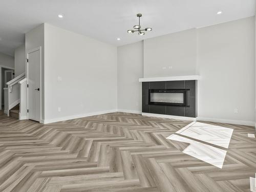 144 Larch Crescent, Leduc, AB - Indoor Photo Showing Living Room With Fireplace