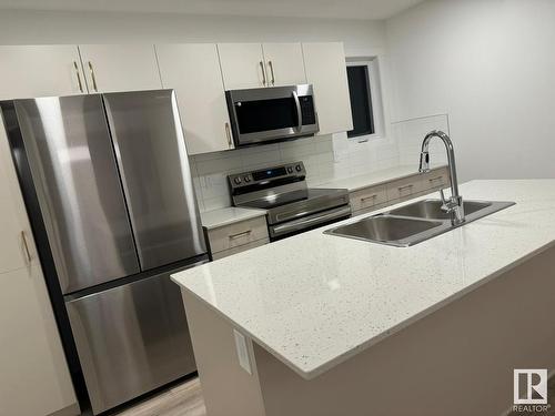 115 1025 Secord Promenade Nw, Edmonton, AB - Indoor Photo Showing Kitchen With Double Sink With Upgraded Kitchen