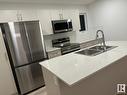 115 1025 Secord Promenade Nw, Edmonton, AB  - Indoor Photo Showing Kitchen With Double Sink With Upgraded Kitchen 