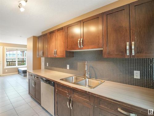 214 401 Southfork Drive, Leduc, AB - Indoor Photo Showing Kitchen With Double Sink