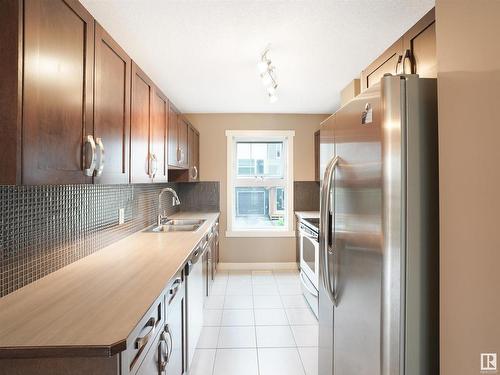 214 401 Southfork Drive, Leduc, AB - Indoor Photo Showing Kitchen With Double Sink