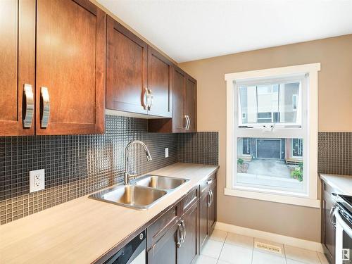 214 401 Southfork Drive, Leduc, AB - Indoor Photo Showing Kitchen With Double Sink