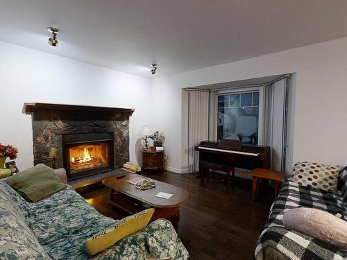 7116 187A Street, Edmonton, AB - Indoor Photo Showing Living Room With Fireplace