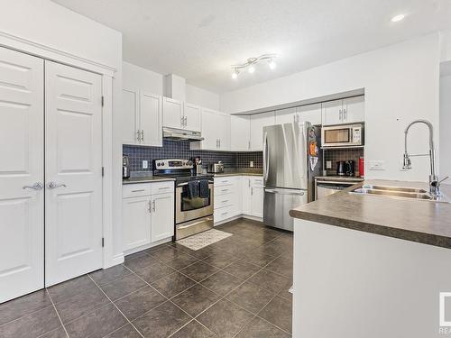 109 801 11 Street, Cold Lake, AB - Indoor Photo Showing Kitchen With Double Sink