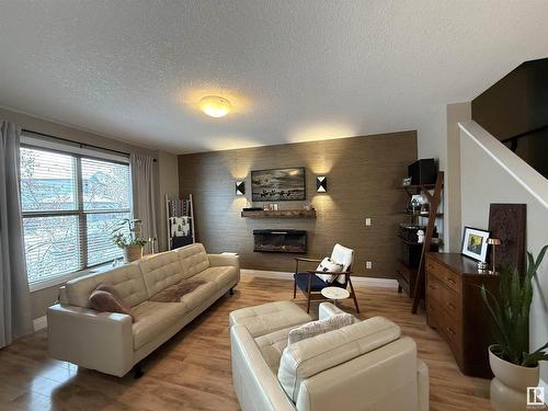 118 Gilmore Way, Spruce Grove, AB - Indoor Photo Showing Living Room With Fireplace